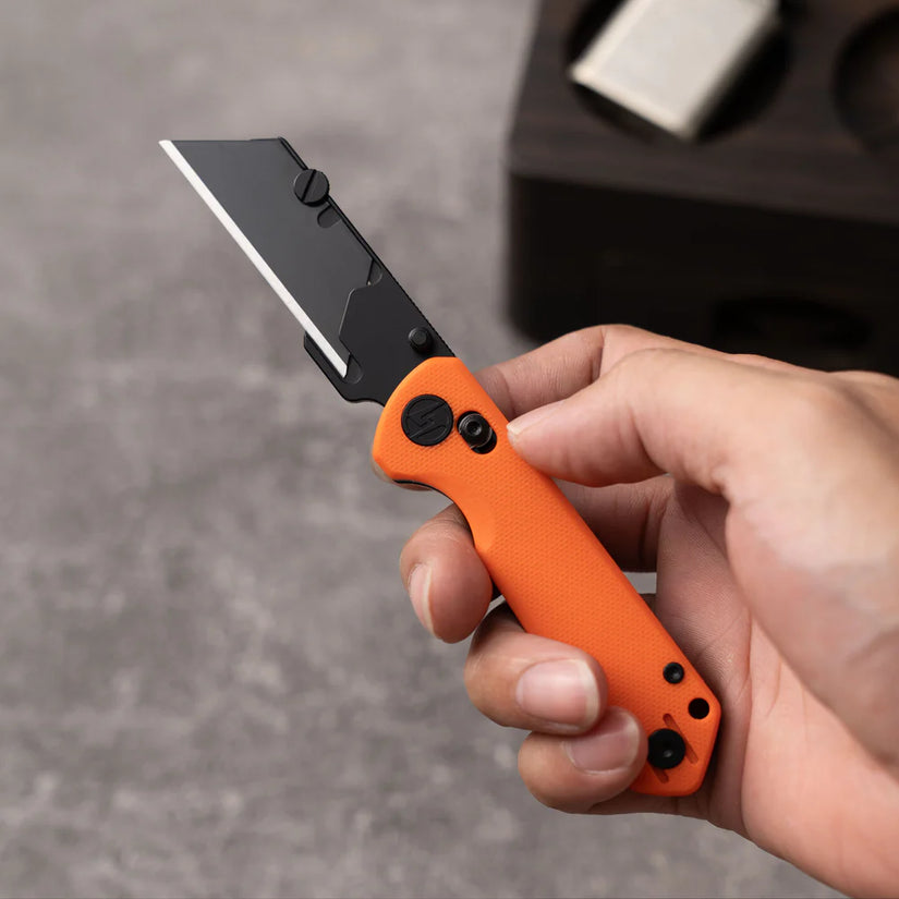Olitans Adélie Penguins G076 - 2.68" Black Utility Blade, Orange G10 Handle