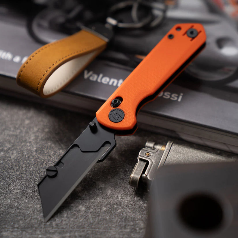 Olitans Adélie Penguins G076 - 2.68" Black Utility Blade, Orange G10 Handle