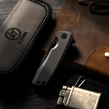 Olitans Bomber T065 - 2.95" M390 Black Stonewashed Blade, Grey Titanium Handle