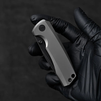 Olitans Bomber T065 - 2.95" M390 Black Stonewashed Blade, Grey Titanium Handle